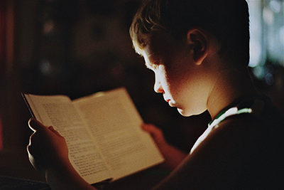 Kid reading a book